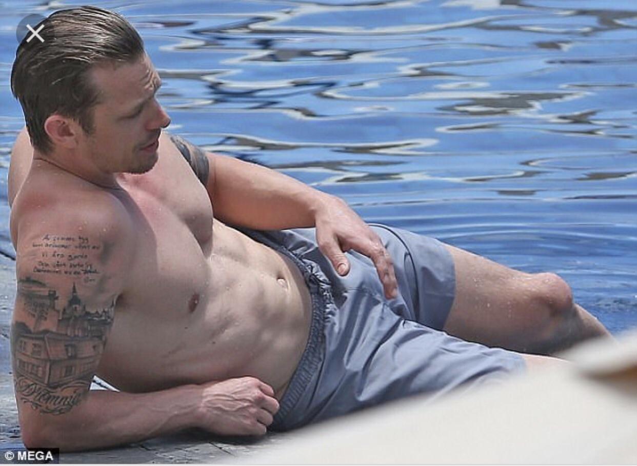 Tanned and Taut: A Beachside Celebration of Masculine Curves